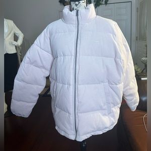 Levi's Women's Zoe Corduroy Puffer Jacket In Light Pink Color with front pockets